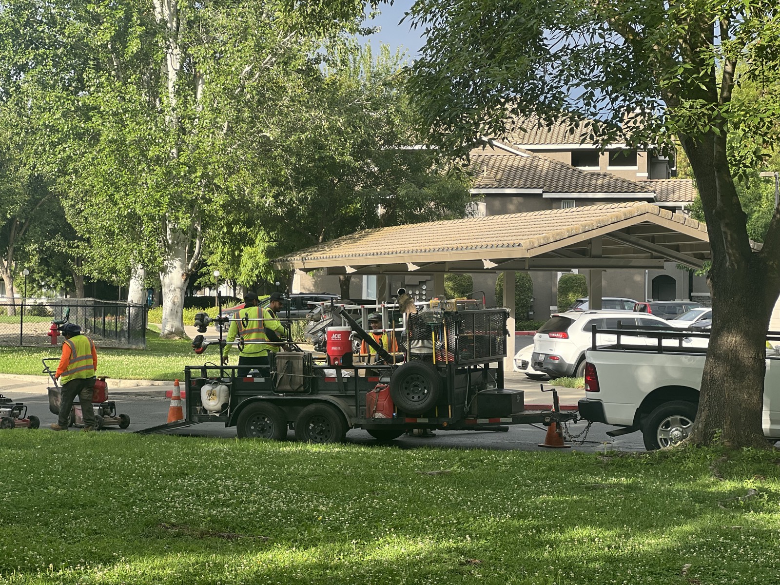 Emerald Green crew unloading mowers from the trailer